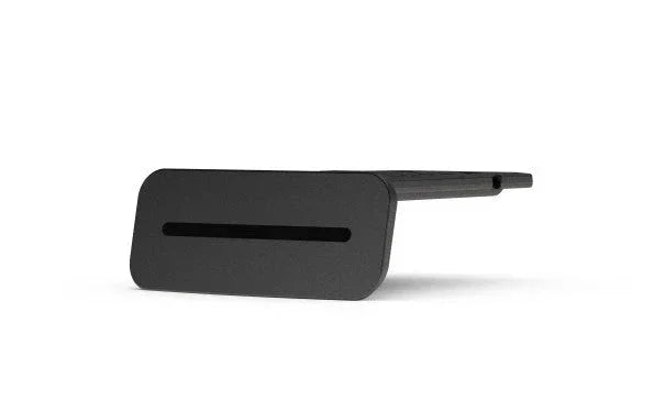 Black plastic CPAP machine accessory with slot, isolated on white background