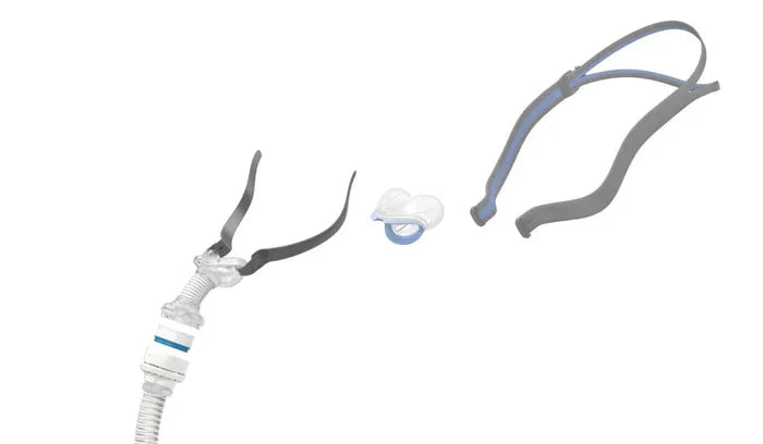 CPAP nasal mask parts including headgear, tubing, and silicone nasal cushion on white background