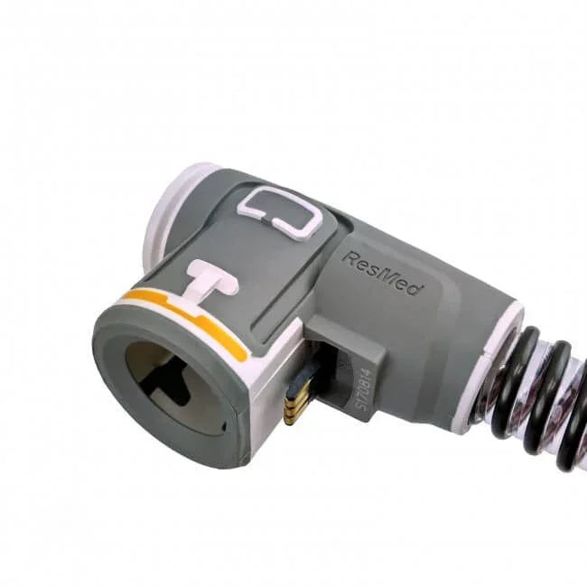 CPAP hose elbow adapter for sleep apnea machine with grey and white plastic design