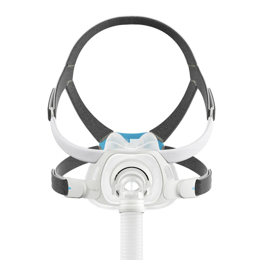 A CPAP mask with a white and gray headband system, featuring a blue accent on the front, shown with an attached white breathing tube against a solid white background.