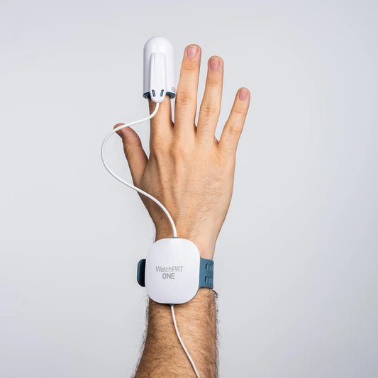 WatchPAT ONE sleep apnea diagnostic device worn on wrist and finger against white background