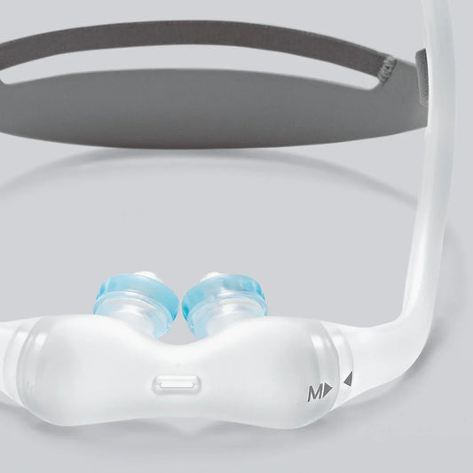 Close-up of gel nasal pillow CPAP mask with clear silicone frame and blue nasal cushions
