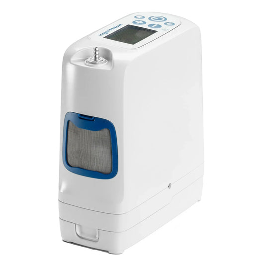 A white portable oxygen concentrator with blue accents, featuring a digital control screen on top, a front air filter window, and a base unit, shown on a solid white background.