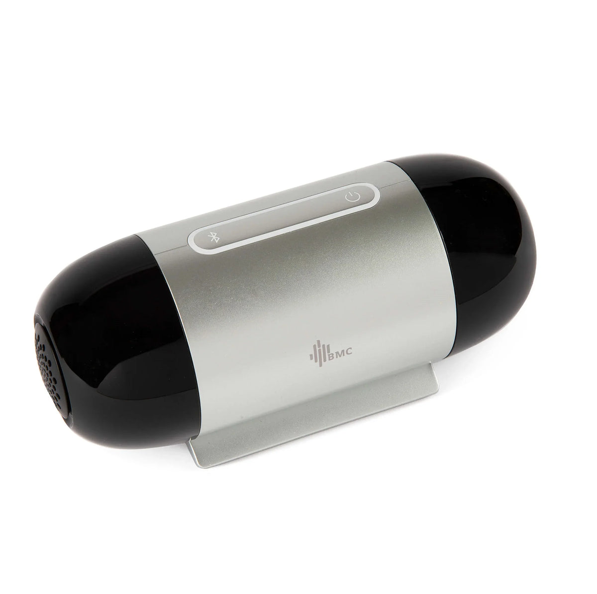 A portable Travel Auto CPAP Machine with a glossy black and silver metallic body, resting on a small white stand against a white background.