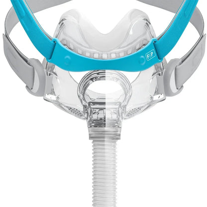 CPAP mask with blue headgear on a white background