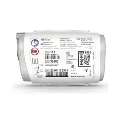 The back of a travel cpap machine, showing various regulatory labels, barcodes, QR codes, and the AirMini brand logo on a white background.