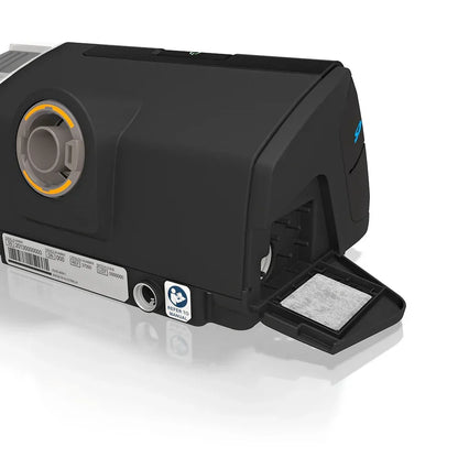 CPAP machine filter compartment open, showing white air filter insert for sleep apnea.