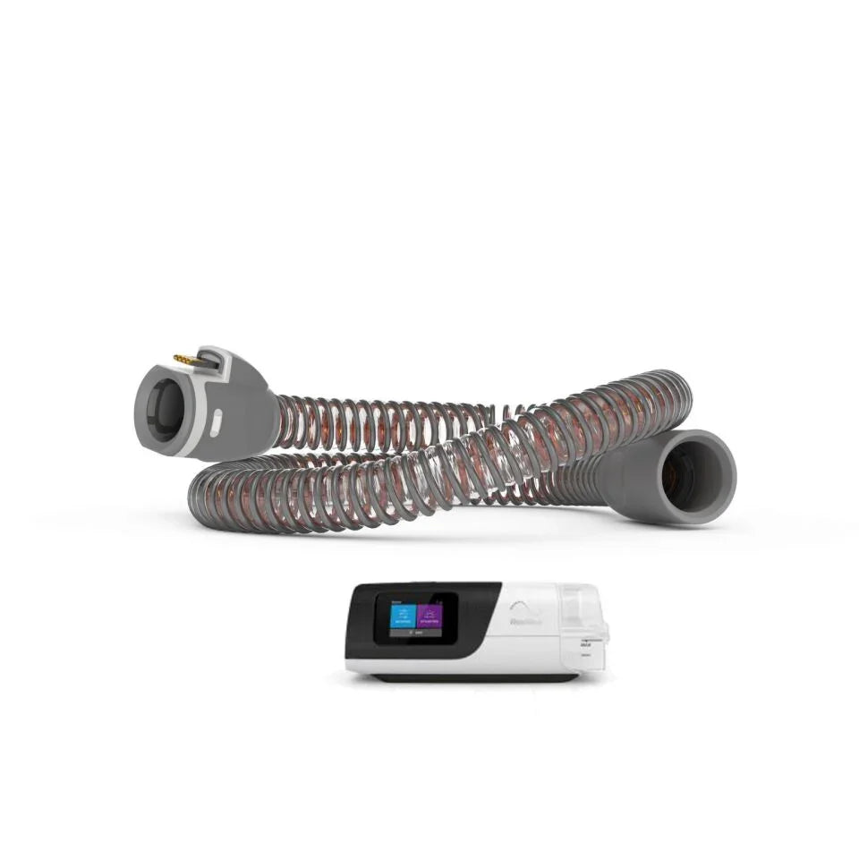 Heated CPAP hose tube and CPAP machine for sleep apnea therapy on white background