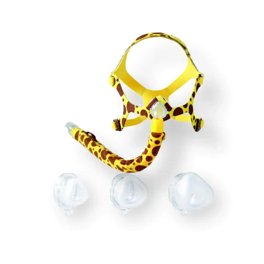 Pediatric CPAP nasal mask with giraffe print, hose cover, and three silicone cushions.