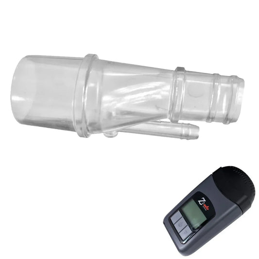 Clear plastic CPAP adapter and compact CPAP machine on white background