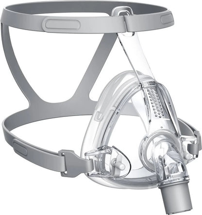A clear full-face mask with a gray head strap and mouthpiece, shown on a plain white background.