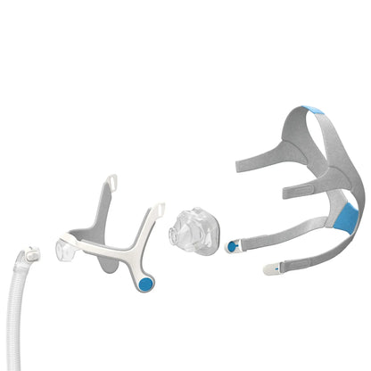 Exploded view of a CPAP nasal mask and headgear components on a white background