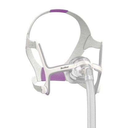 ResMed CPAP nasal mask with white and purple headgear and corrugated tubing