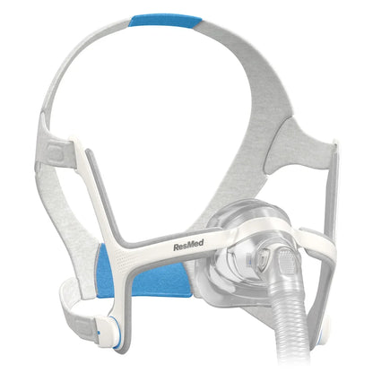 Nasal CPAP mask with headgear, clear cushion and blue padding for sleep apnea therapy