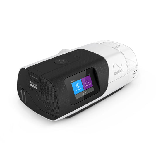ResMed AirSense 11 AutoSet CPAP machine left side view with integrated humidifier