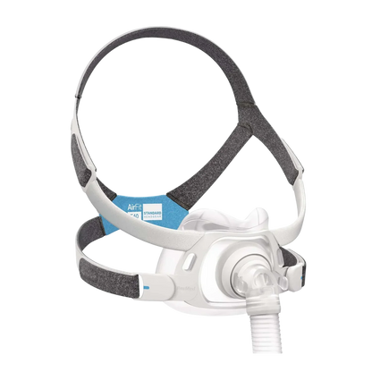 A ResMed F40 CPAP mask with a white plastic facepiece, clear tubing, and a gray and white adjustable headband with a blue and white F40 label.