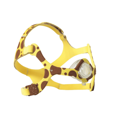 Yellow giraffe print CPAP nasal mask for pediatric patients on a green background